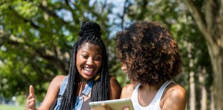 Afro women using tablet computer in the park