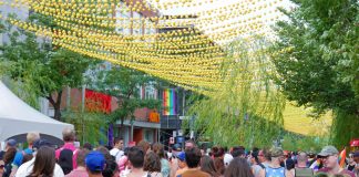 Crowd of people walking in Montreal's gay neighborhood during the Pride Parade